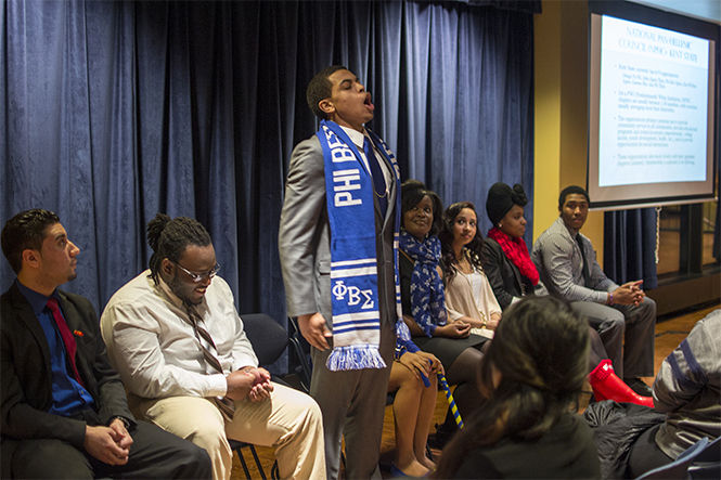 Political science major Camara Thomas “calls” to his brothers of Phi Beta Sigma while introducing himself at the Multicultural Greek Info Night on Wednesday Feb. 4, 2015. Calls are common in many multicultural greek organizations and each call is unique to is sorority of fraternity.