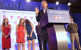 Governor John Kasich celebrates his reelection with a roaring crowd at the Republican Parties watch party in Columbus on Tuesday, Nov. 4, 2014.