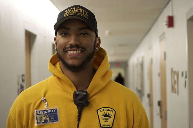 Julien Johnson, a senior philosophy major, has worked as a security aide for nearly three years. He prides himself in getting to know the residents he looks after.