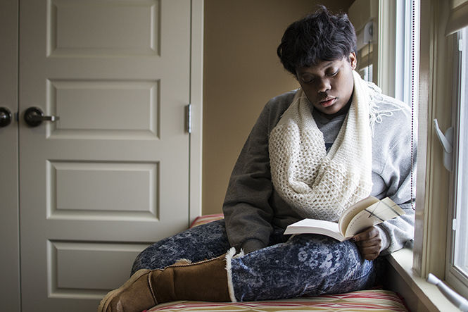 Sophomore fashion merchandising major, Quierston Byers, reads the book Intro 14 in the Wick Poetry Center on Tuesday March 10, 2015. The Wick Poetry center has a quiet and comfortable reading room on the third floor.