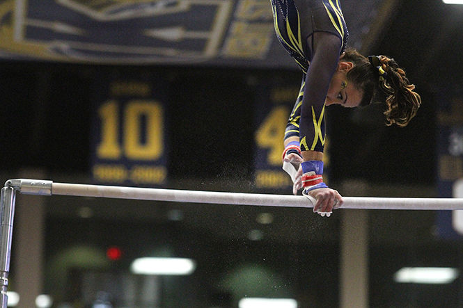 Kent State's Rebecca Osmer competes on the uneven bars during the meeting against Ball State University on Sunday, March, 8, 2015. Rebecca Osmer finished her routine with a 9.875. The Flashes won 196.800-195.50.