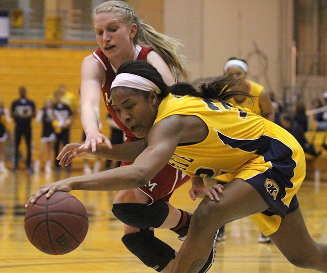 Kent State forward Montia Johnson steals the ball from Miami of Ohio, Sunday, Feb. 23 2014, in the M.A.C.C. Kent State won, 67-51.