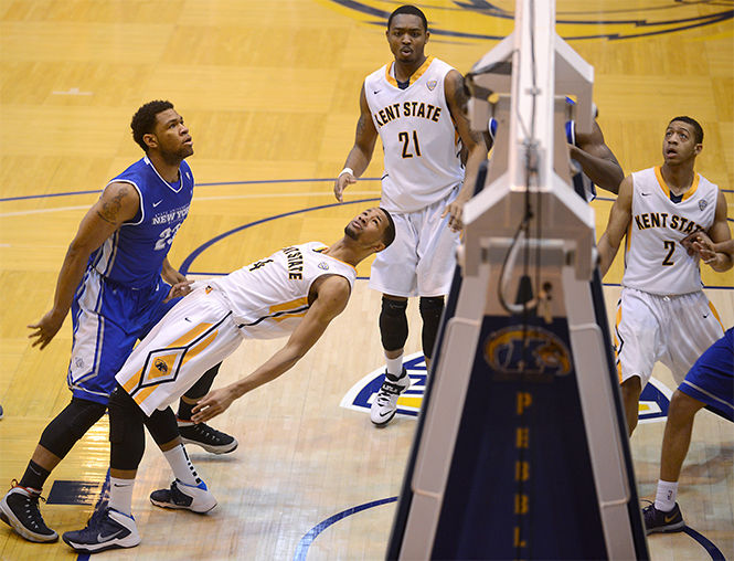 Kent State defense awaits the outcome of a shot taken by the Bulls' in their losing game against Buffalo, Saturday, Feb. 22, 2014, in the M.A.C.C. The final score was 78-69.