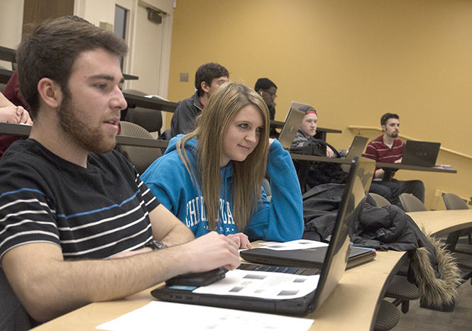 Lexie Nagy, a sophomore computer information systems major sits in her Systems Analysis and Design class in the Business Administration Building on Tuesday, March 3, 2015. The number of women in the computing field is low despite the growing number of women in the workplace.