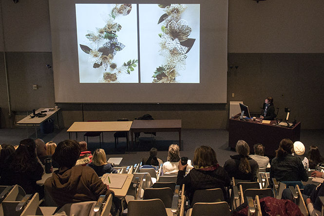 Artist Piper Shepard talks to art students about her practice on Friday March 6, 2015. Shepard works with cloth cutting them into intricate lace designs.