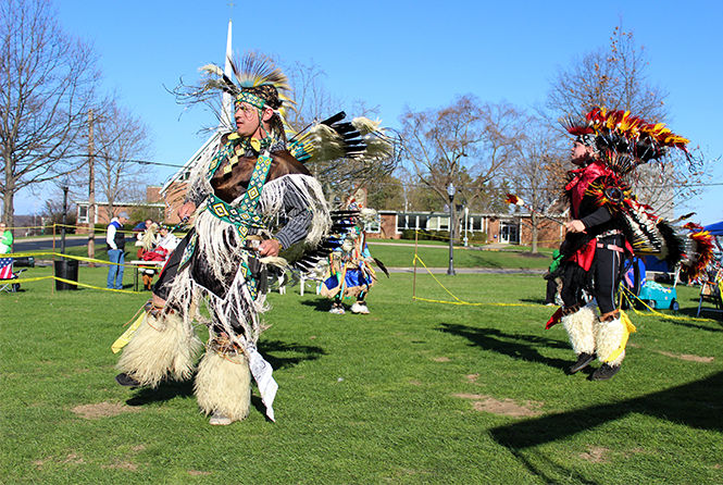 File photo by MaKayla Brown for The Kent Stater Roy Bailey (left) and Dustin Mayfield (right) dance at the Native American Pop Wow outside the Music and Speach buidling on April 26, 2014.