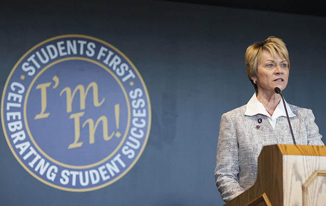 President Beverly Warren speaks at the grand opening of the Center for Undergraduate Excellence on April 28, 2015. "Students first is my number one priority," said Warren. "I'm in on this experience," she said, referring to the sign behind her. "I'm in on the students that make up this wonderful university."