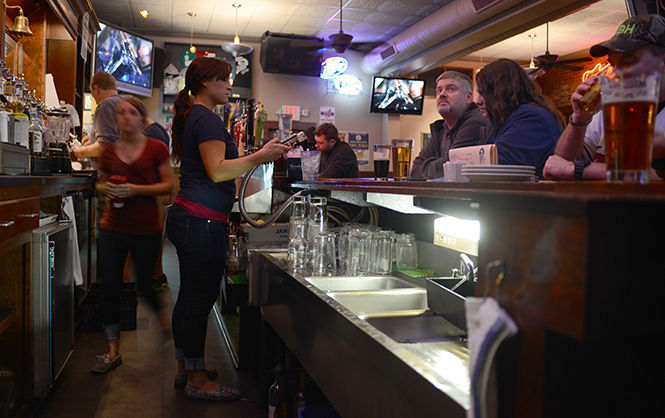 The Ray's staff keeps busy behind the bar on Tuesday night during the Indians vs. Padres game on April 8, 2014.