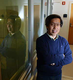 Hiroshi Yokoyama, director of Kent State's Liquid Institute, poses for a portrait outside of the third floor laboratory that will be the primary facility for incoming students of a new Liquid Crystal master's program in fall of 2015. Yokoyama will direct the new program.