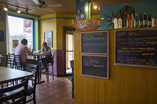 Jeffery Gamberling and Hallie Walker, juniors at Kent Roosevelt High School, sit together at Taco Tontos on Monday, April 6, 2015.