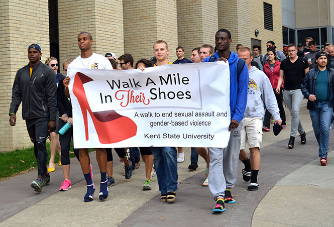 Students walk down the Esplanade in women's shoes on April 14, 2015. “Walk a Mile in Their Shoes,” raised awareness for sexual violence and rape.