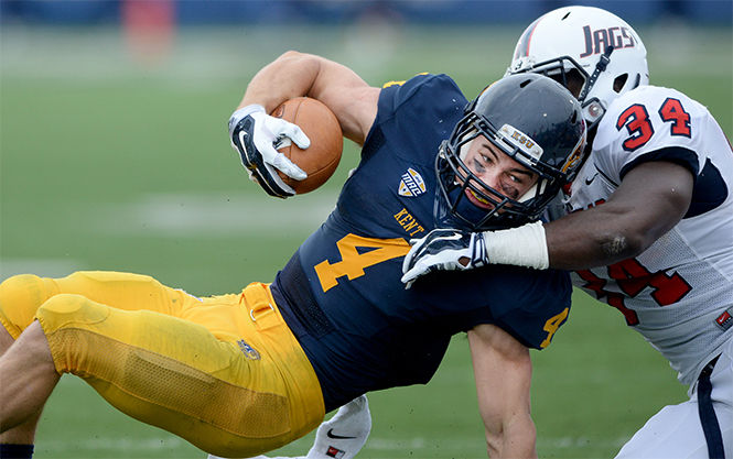 Sophomore wide receiver Nick Holley gets tackled by the Jaguars' Desmond LaVelle at the game against Southern Alabama Saturday, Sept. 6, 2014.