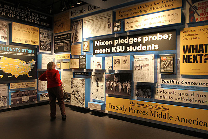 Kent State alumna Susan Avery, of Denver, Colorado, tours the May 4 Visitors Center Wednesday, Sept. 17, 2014. Avery graduated in '82 and said that she wanted to visit the center to pay her respects.