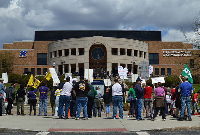 Members of campus union AFSCME and student organization USAS picket outside the M.A.C. Center on May 1, 2015, as President Beverly Warren is inaugurated inside. The Board of Trustees and AFSCME both accepted a report from a fact-finder Thursday, bringing a successful end to the negotiation process and preventing campus workers from potentially going on strike.