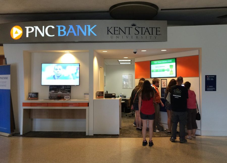 Students and parents gather around the new campus branch of PNC Bank at the Kent State Student Center to get information and set up accounts on Aug. 27, 2015. A table has been set up next to it to aid in helping students and parents. The branch officially opened August 3.