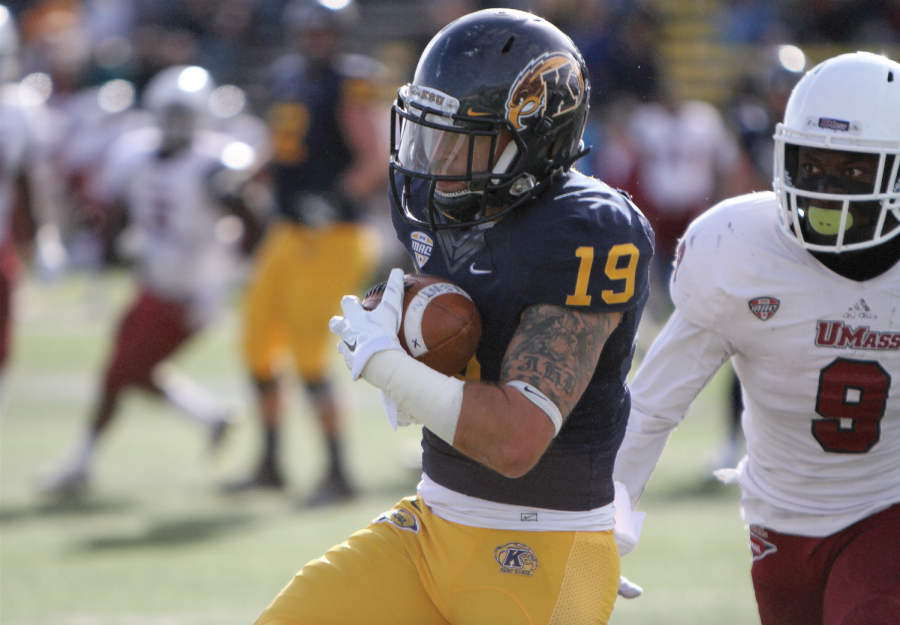 Senior wide receiver Josh Boyle completes a pass in the end zone, scoring one of the two touchdowns at the game against the University of Massachusetts on Saturday, Oct. 11, 2014.