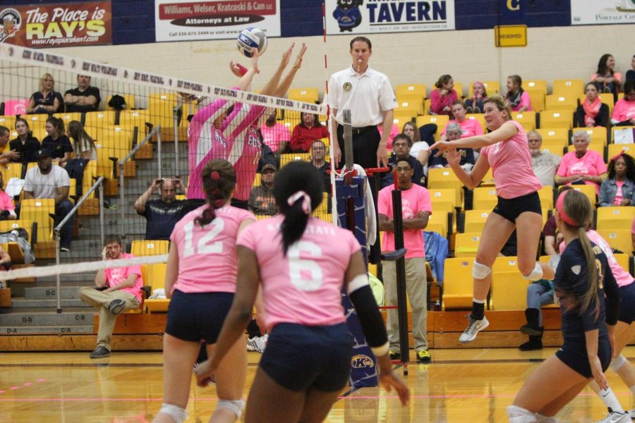 Opposite hitter Kelly Hutchison from the Flashes spikes the ball at the annual 'Dig for the Cure' volleyball match vs. Northern Illinois at the MAC Center on Oct. 24, 2014.