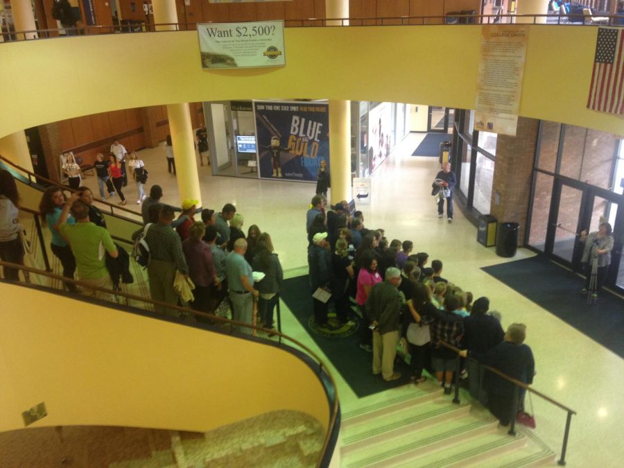 Alumni gather for a group photo in the Student Center after a brunch for alumni and their legacies on Saturday, Sept.12, 2015.