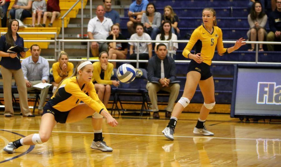 Sophomore Kelsey Bittinger digs the ball agianst Miami University on Friday Sept. 25, 2015.