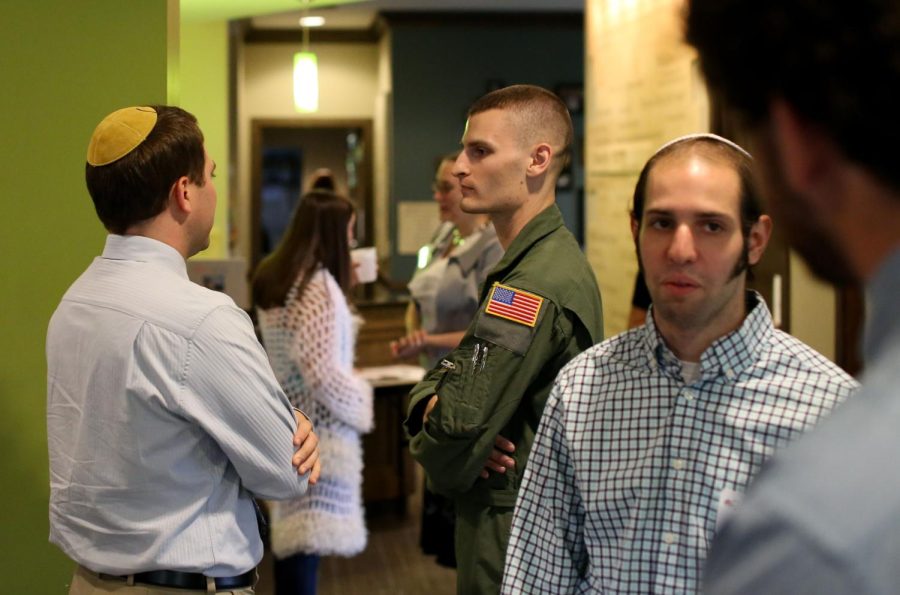 Students mingle in the lobby of The Hillel Cohn Center before the annual Erev Rosh Hashana service on Sunday Sept. 13, 2015.