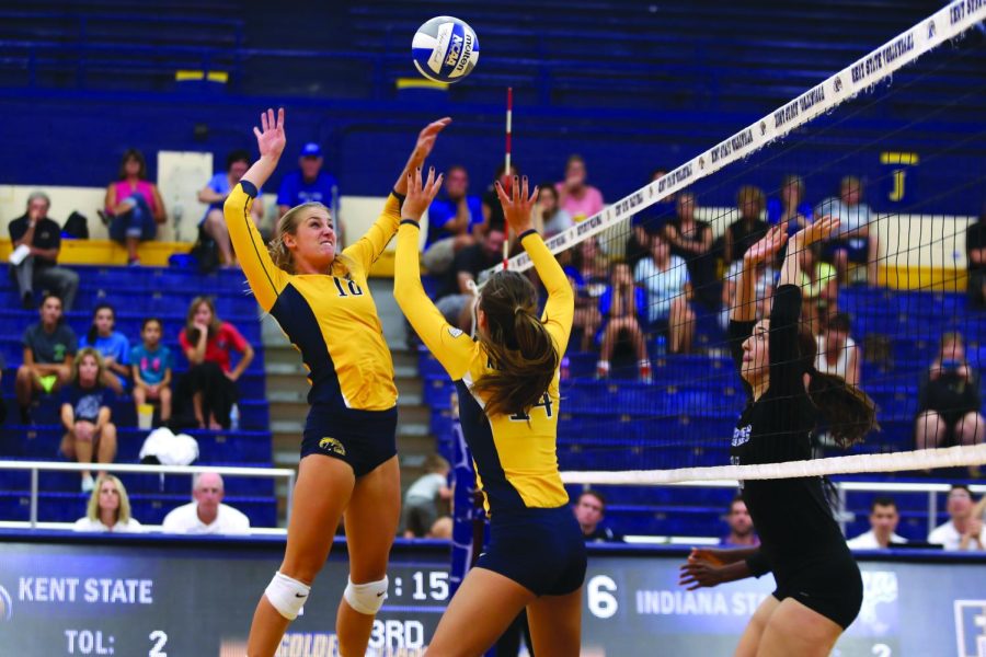 Junior Katarina Kojic sets junior Drew Norberg up for a hit against Indiana State During the Golden Flashes Classic on Friday Sept. 4, 2015.