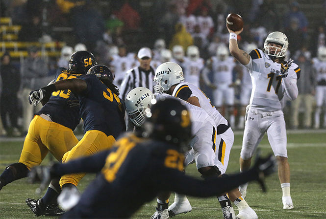 Kent State defense goes up against the Univeristy of Toledo's quaterback at the game Tuesday, Nov. 4, 2014. The Flashes lost 30-20.