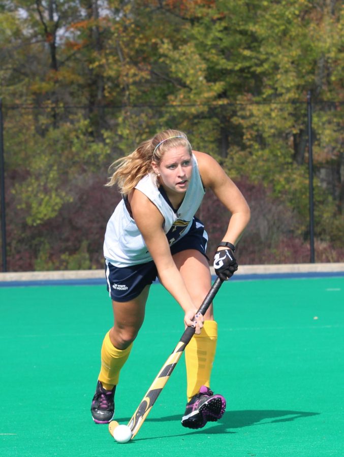 Susanne Felder, senior back from Berlin, Germany catches a pass and gets ready to take the ball up field Wednesday, Oct. 7, 2015. Susanne is one of the ten International players on the Kent State University girls Field Hockey team.