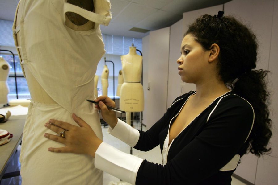 Photo Courtesy of TNS: Jocelyn Simms, a senior design student at the Fashion School at Kent State University and who attended the campus extension in New York last year, works on her senior project in Kent, Ohio, Friday, October 20, 2006. (Lew Stamp/Akron Beacon Journal/MCT)