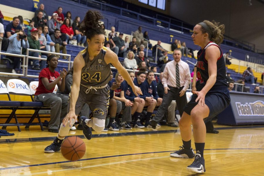 Freshman guard Alexa Golden drives around a player from Malone University on Saturday, Nov. 28. 2015. The Flashes defeated Malone at the MACC 73-59.