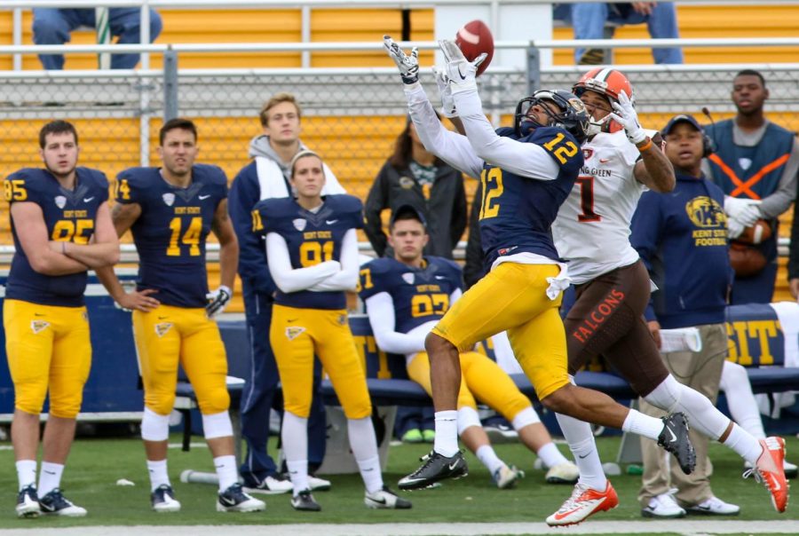 Junior corner Najee Murray goes for the interception against a BGSU receiver on Saturday, 24, 2015. BGSU’s receicer took the ball out of Murray’s hands and scored a touchdown to push BGSU’s lead to 31.