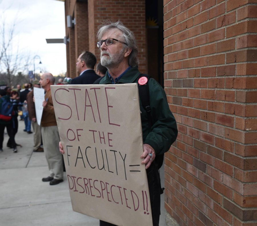 Political science professor Patrick Coy protests outside the KIVA during the State of the University Address on Thursday, Nov. 19, 2015. Coy said, "In order for Kent State to continue to become a great university, we must invest in our teachers. Every administrator knows that in their heart." 