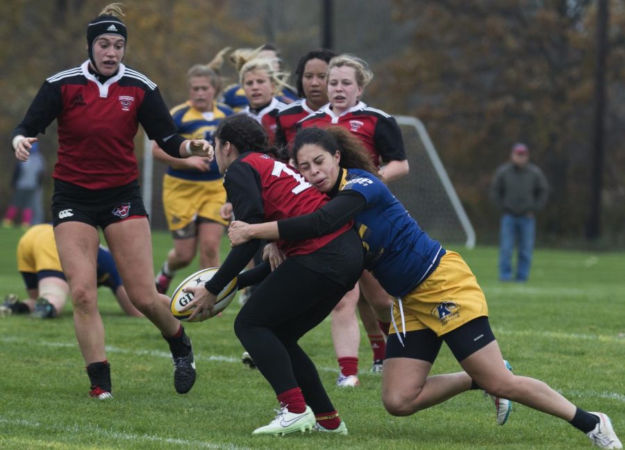 Kent State women's rugby junior Michaela Williams tackles a Devenport player during their 57-0 loss on Saturday, October 31, 2015.