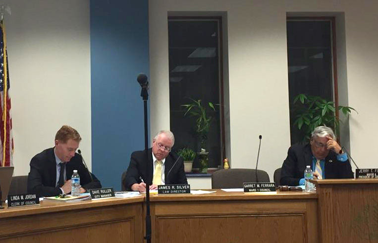 (from left) City manager Dave Ruller, city law director James R. Silver and Kent mayor Jerry T. Fiala sit at a city council meeting on Wednesday, Nov. 18, 2015.