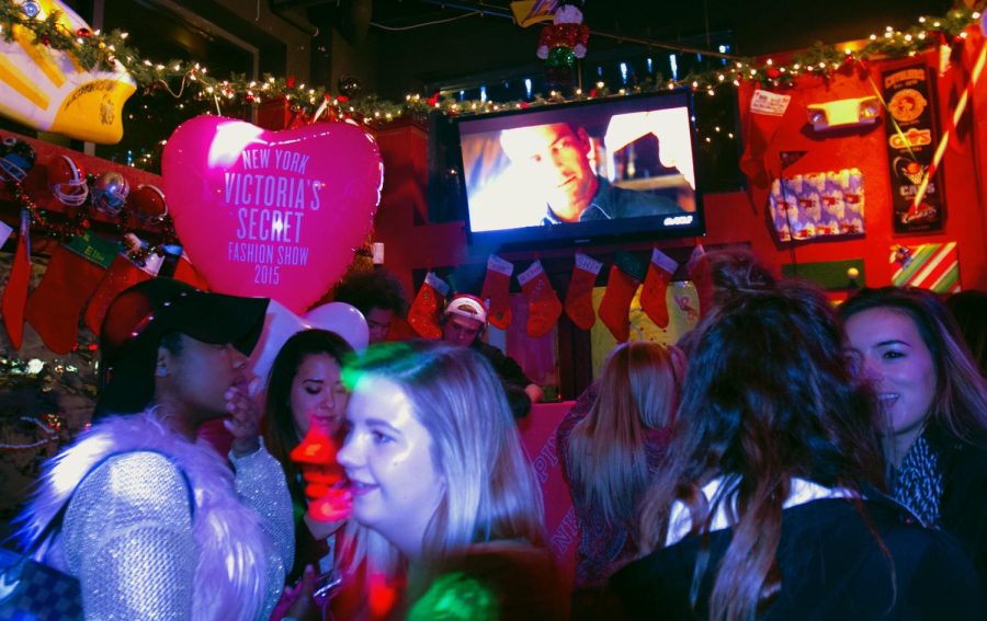 Ladies attend the Victoria's Secret Fashion Show viewing party hosted by Kent State Victoria Secret PINK representatives at Panini’s Bar and Grill in downtown Kent on Dec. 8, 2015.