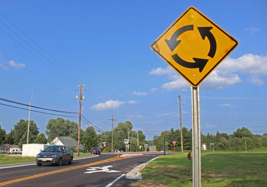 Traveling cars exit the roundabout on Powdermill road on July 31, 2014.