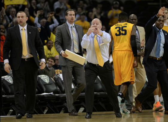 Kent State head coach Rob Senderoff reacts as Jimmy Hall makes a basket during the first half of the MAC Tournament game against the University of Akron on Thursday, March 12, 2015, in Quicken Loans Arena. The Flashes fell to the Zips, 53-51.