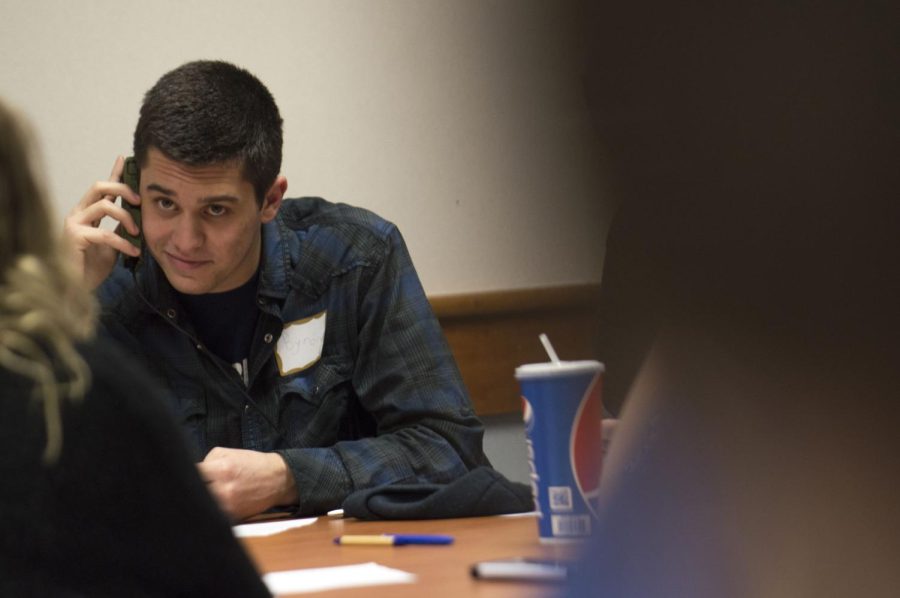 Brian DiPaolo, a junior history major, participates in the College Democrats phone campaign to sway voters away from Donald Trump on Tuesday, Jan. 26, 2016 in the Kent State Student Center.