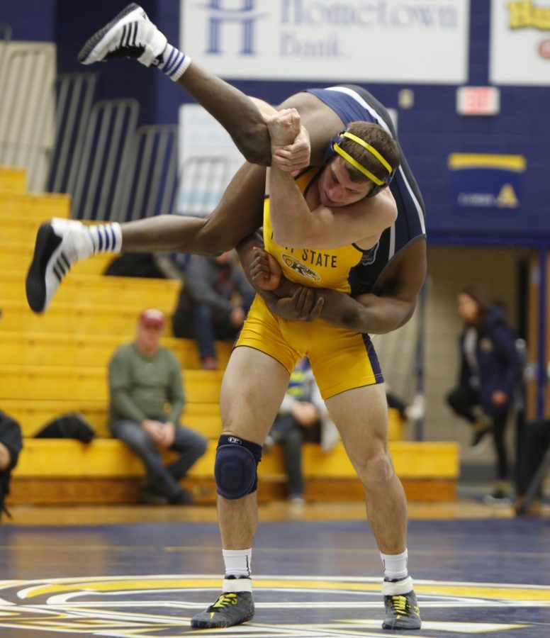 Kent State fifth-year wrestler Tyler Buckwalter flips a wrester from Old Dominion University during a meet at the M.A.C. Center on Sunday, Jan. 24, 2016. The Flashes won the meet, 25-13.