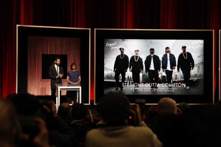 Actor John Krasinski and Academy President Cheryl Boone Isaacs "Straight Outta Compton" as a nominee for Original Screenplay at the announcement of the 88th Academy Awards nominations during a live news conference on Jan. 14, 2016 at the Academy's Samuel Goldwyn Theater in Beverly Hills, Calif.