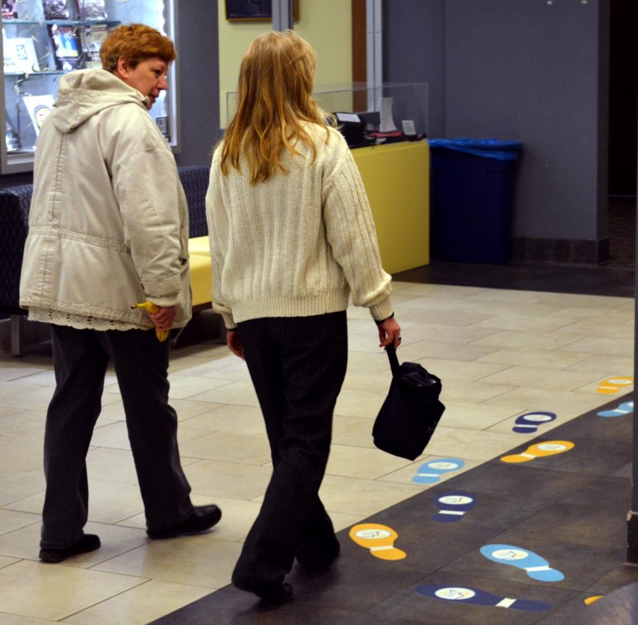 Two faculty members decide to take the stairs and participate in Kent State’s “Step Your Way Up” campaign on Wednesday, Jan. 27, 2016.