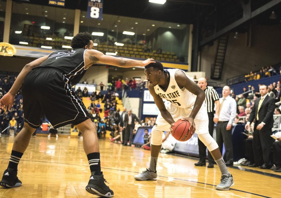 Redshirt junior Jimmy Hall prepares to drive to the rim against the Northern Illinois defender on Tuesday, Feb. 9, 2016 at the M.A.C. Center. The Flashes beat the Huskies 75-74.