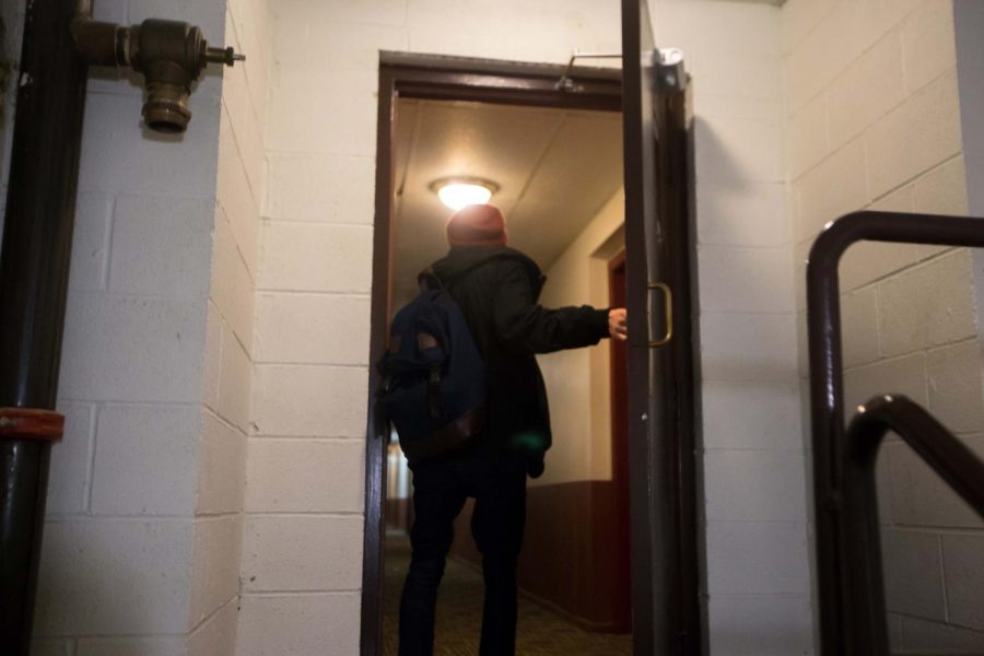 Sophomore accounting major Trevor Gorfido walks through the door to the seventh floor of College Towers on Thursday, Feb. 25, 2016. Gorfido walks up seven flights of stairs everyday because the elevators scarcely work in his building.