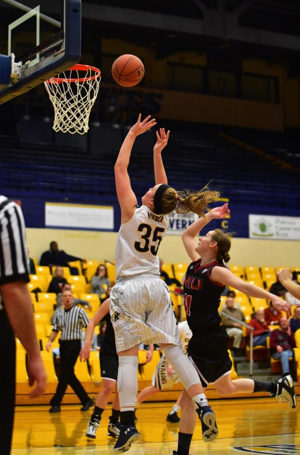 Sophomore forward Jordan Korinek shoots a layup in the game against Northern Illinois University on Wednesday, Jan. 27, 2015. The Flashes won 95-85.