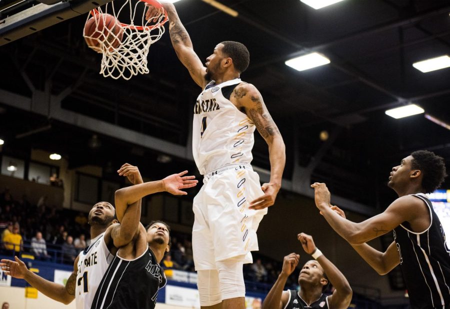 Senior forward Chris Ortiz slams back an offensive rebound during the second half against Northern Illinois at the M.A.C. Center on Tuesday, Feb. 9, 2016. The Flashes won, 75-74.