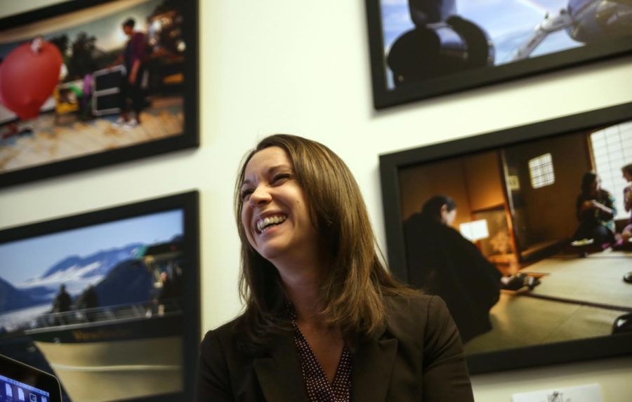 White House photographer, Amanda Lucido smiles as she works inside her office at the Eisenhower Executive Office Building on Friday, Feb. 19, 2016.