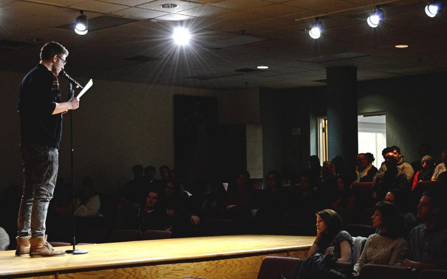 German international student Yannik Cartsensen recites his poetry at the Celebrating Our Own Scholarship Reading in the Rockwell Hall auditorium. Wednesday, Feb. 10, 2016.