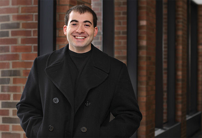 Junior criminology and justice studies major Ryan Lewand stands in the Student Center on Friday, Jan. 23, 2015. Lewland was a petty officer, second class in the Navy and he served a total of two years in Bahrain.