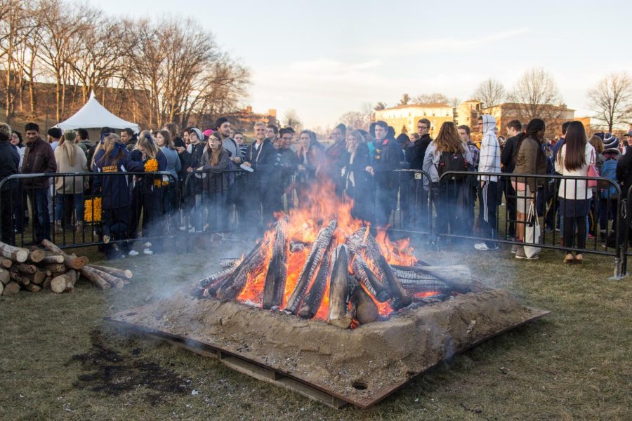 Students stand around the bonfire held in Manchester Field after the official announcement of Kent State's rebranding on Monday Feb. 1, 2016.