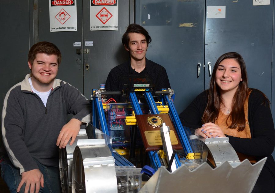 (from left) Senior Joshua Ishihara, senior Dan Kish and sophomore Sarah Rosenbaum with their award-winning robot digger, "Cyborg Betty,” on Friday, Jan. 29, 2016.