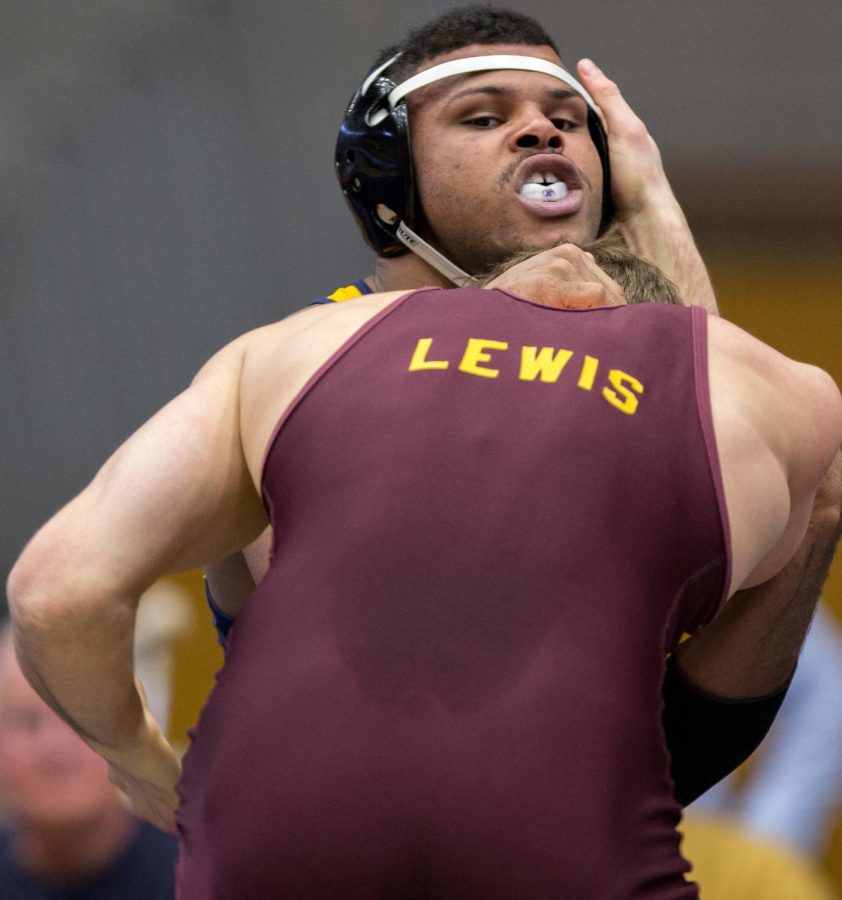 Redshirt freshman Kyle Conel wrestles Jackson Lewis of CMU in the MACC on Sunday Feb. 14. Conel won 6-3. Kent beat CMU 18-17.